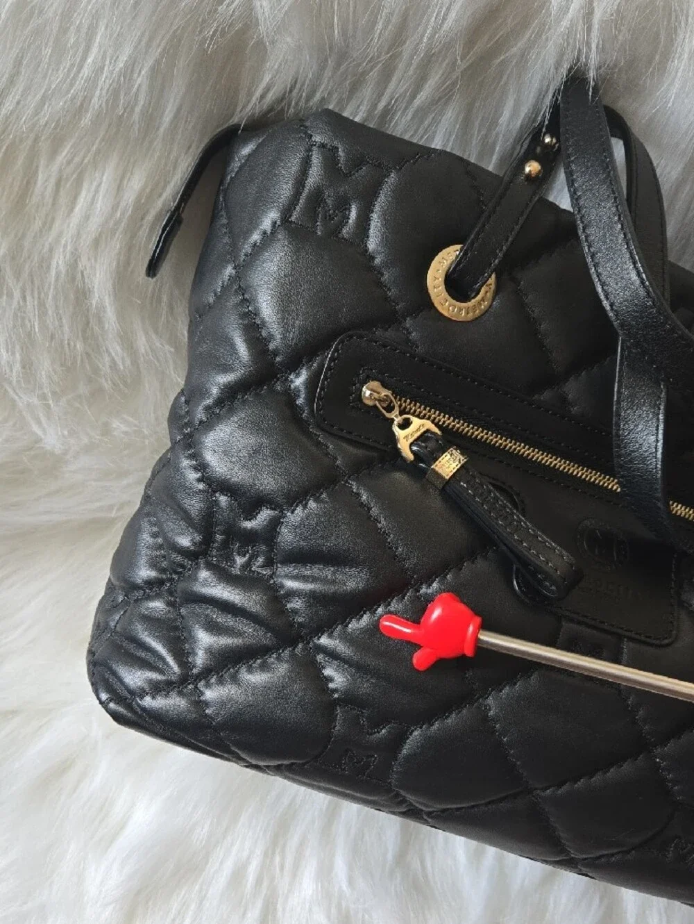 Quilted Black Tote with Gold Medallion Accent